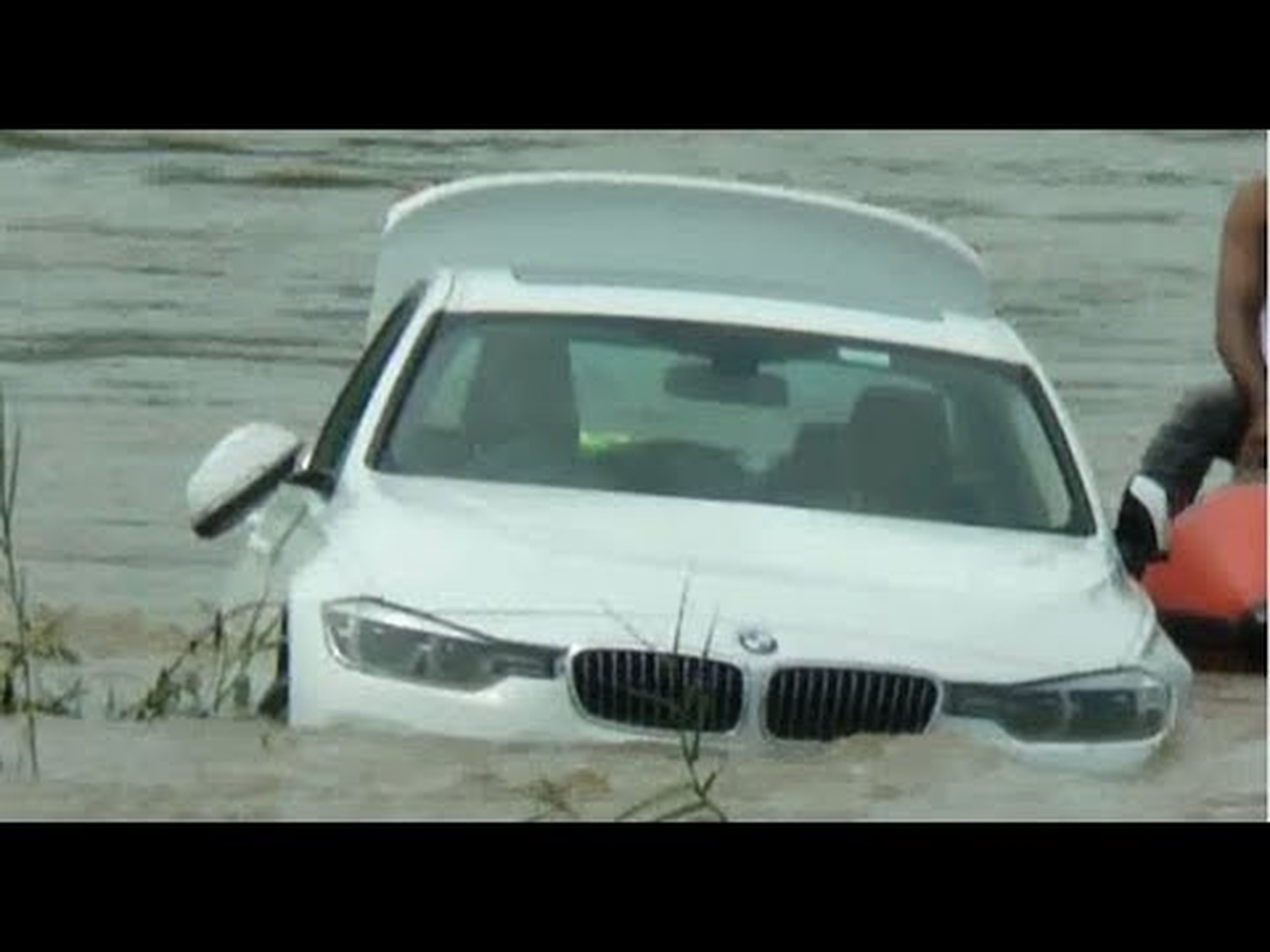 Youth Pushes Luxury BMW in River after father denies New Jaguar Car Request